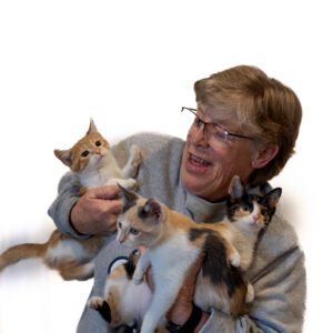LL_TwoCats Happy Volunteer holding two cats