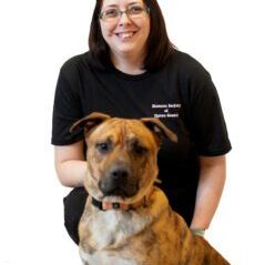 Happy volunteer with a dog.